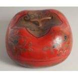 A LARGE CHINESE LACQUERED WOOD LIDDED FOOD BOX, in the form of a pumpkin, 36cm wide (at longest