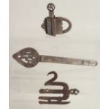 AN ISLAMIC STEEL PADLOCK, together with two other steel items; alam finial and helmet noseguard, (