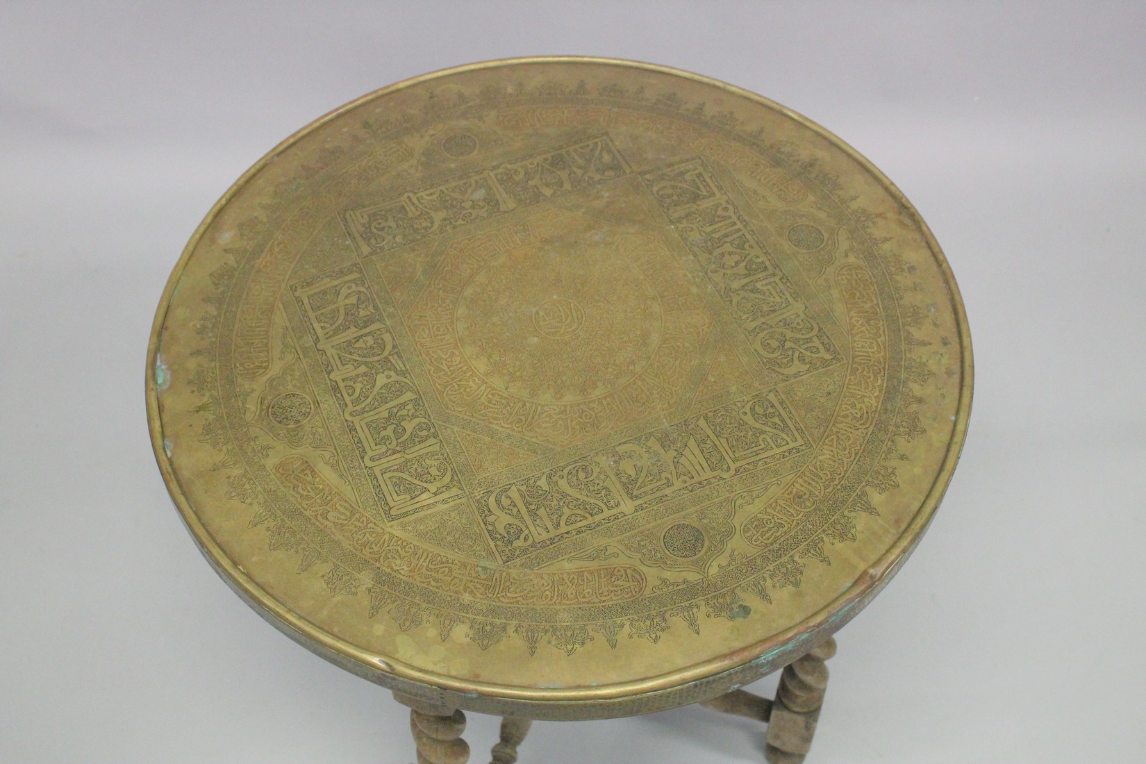 A FINE 19TH CENTURY MAMLUK REVIVAL BRASS TABLE, with folding wooden 'X' form legs, engraved with - Image 2 of 5