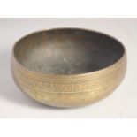 A 15TH/16TH CENTURY MAMLUK ENGRAVED BRASS BOWL, the exterior with a band of calligraphy. 15.5cm