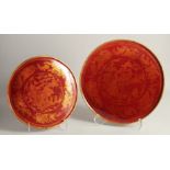 TWO CHINESE GILDED LACQUERED CIRCULAR PANELS, each decorated with a central landscape scene and