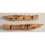 A PAIR OF CHINESE CARVED WOOD BOATS, 28cm long.