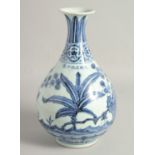 A CHINESE BLUE AND WHITE PORCELAIN VASE, decorated with native flora, bearing a six-character