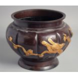 A JAPANESE BRONZE RELIEF DECORATED BOWL, with gilded birds on branches and engraved decoration, 23cm