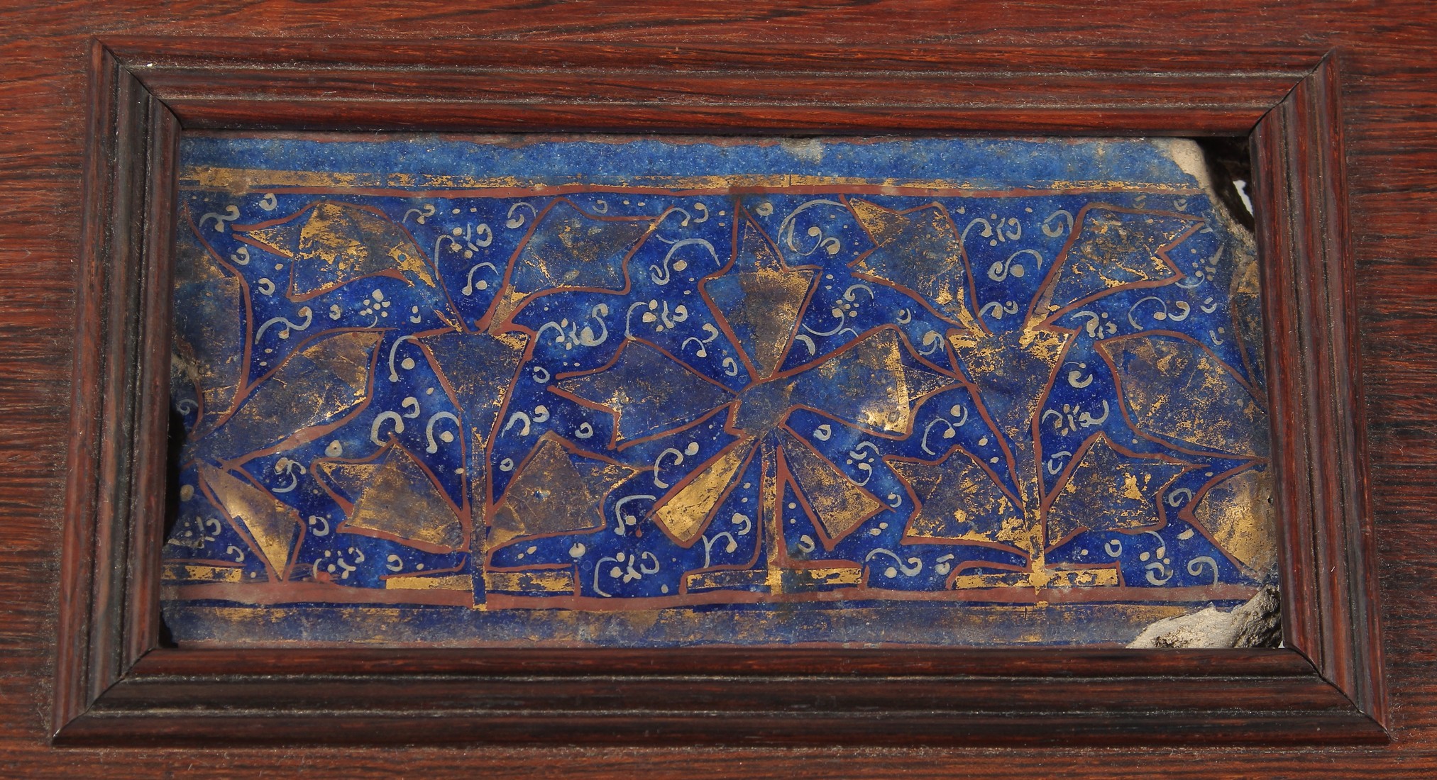 FOUR 12TH/13TH CENTURY PERSIAN LAJVARDINA AND KASHAN LUSTRE POTTERY TILES, united in a wooden frame, - Image 2 of 6
