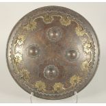 A PERSIAN QAJAR STEEL SHIELD, with gold vine and foliate decoration, the centre with four raised