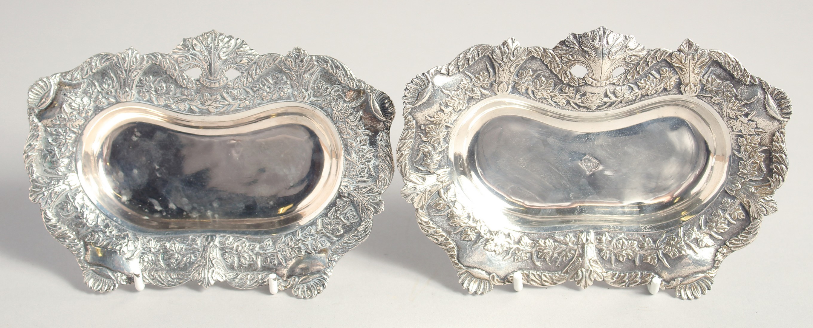 A PAIR OF 19TH CENTURY TURKISH OTTOMAN SILVER DISHES, stamped, weight 360g (together), 16cm x 11cm.