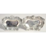 A PAIR OF 19TH CENTURY TURKISH OTTOMAN SILVER DISHES, stamped, weight 360g (together), 16cm x 11cm.