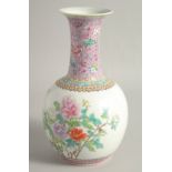 A CHINESE FAMILLE ROSE PORCELAIN BOTTLE VASE, decorated with flora, the reverse with script, the