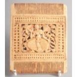 A SOUTH INDIAN STYLE COMB-SHAPED CARVING with a central panel of a dancing lady. 9cm x 7.5cm