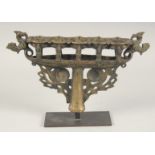 AN ISLAMIC CAST BRONZE FIVE BURNER CANDLESTICK, mounted to a later stand, 31cm wide.