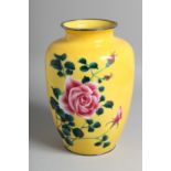 A JAPANESE YELLOW GROUND CLOISONNE VASE, decorated with floral spray. 24cm high