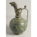 A LARGE SELJUK STYLE BRONZE EWER, with engraved decoration to the neck and spout, drop rings, and