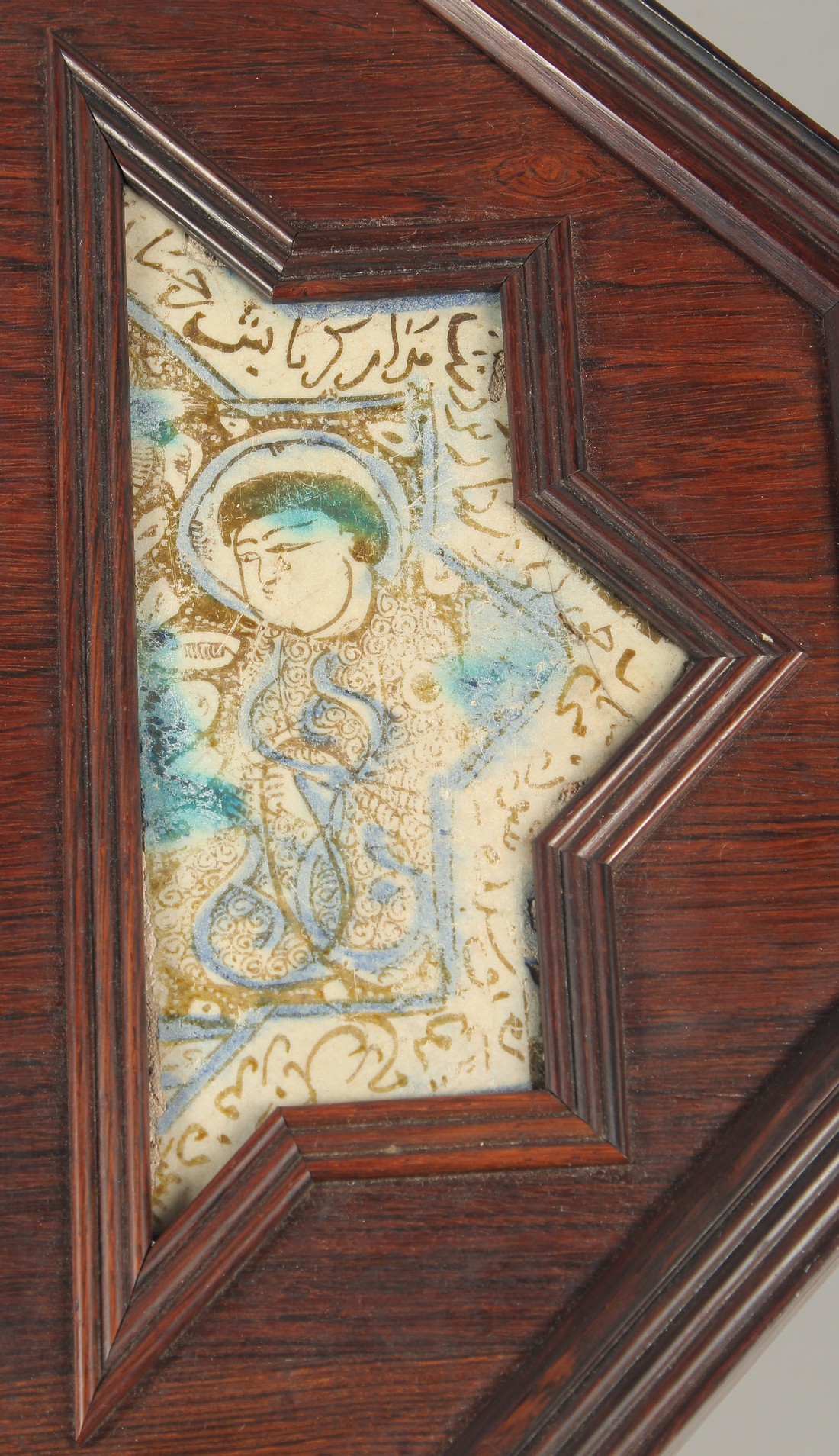 FOUR 12TH/13TH CENTURY PERSIAN LAJVARDINA AND KASHAN LUSTRE POTTERY TILES, united in a wooden frame, - Image 4 of 6