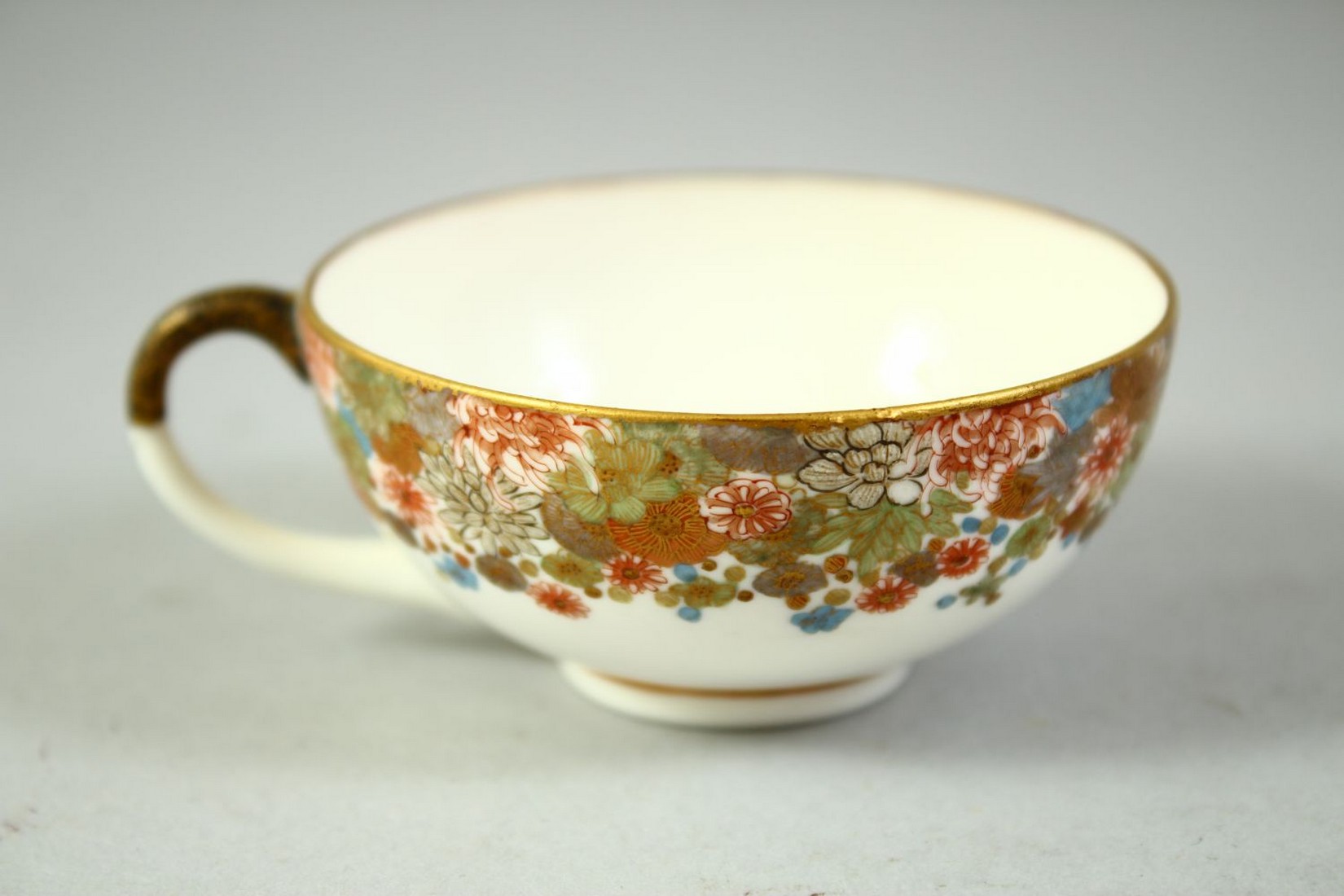 A SMALL JAPANESE SATSUMA CUP AND SAUCER, finely decorated with flowers and butterflies, each piece - Image 2 of 6