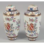 A PAIR OF SAMSON FAMILLE ROSE PORCELAIN VASES AND COVERS, each with central crest and floral