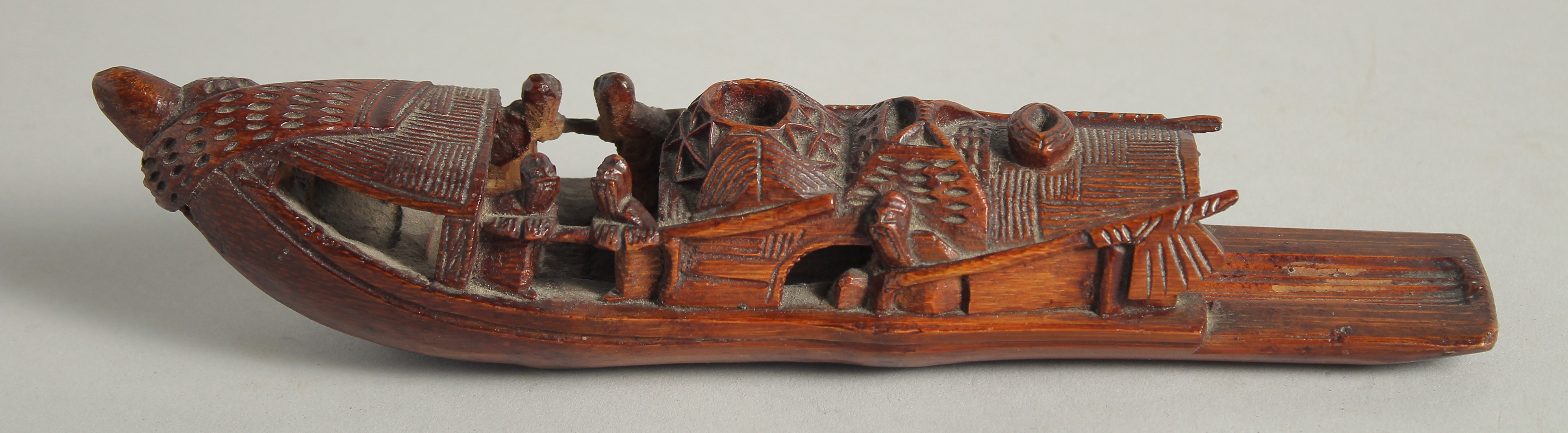 A CHINESE CARVED WOOD MODEL OF A BOAT, 22cm long. - Image 2 of 4