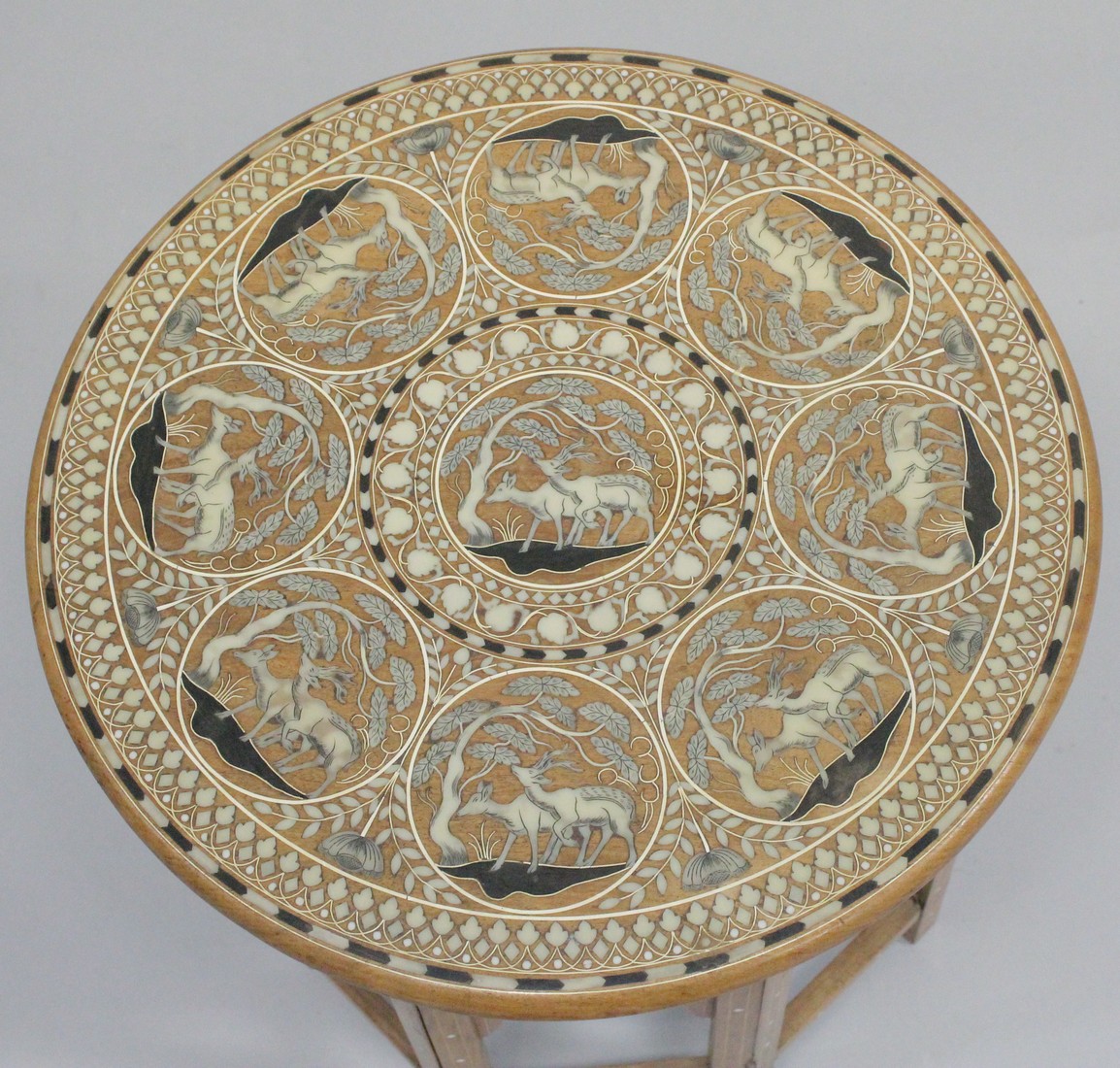 A GOOD AND UNUSUAL INDIAN BONE INLAID CIRCULAR HARDWOOD TABLE, with folding base, the top inlaid - Image 2 of 4