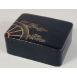 A JAPANESE LACQUERED WOOD BOX AND COVER with gilt decoration to the lid. 13.5cm x 10cm