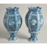 A PAIR OF CHINESE BLUE AND WHITE PORCELAIN HEXAGONAL LAMPS, with pierced panels and bases, 26.5cm