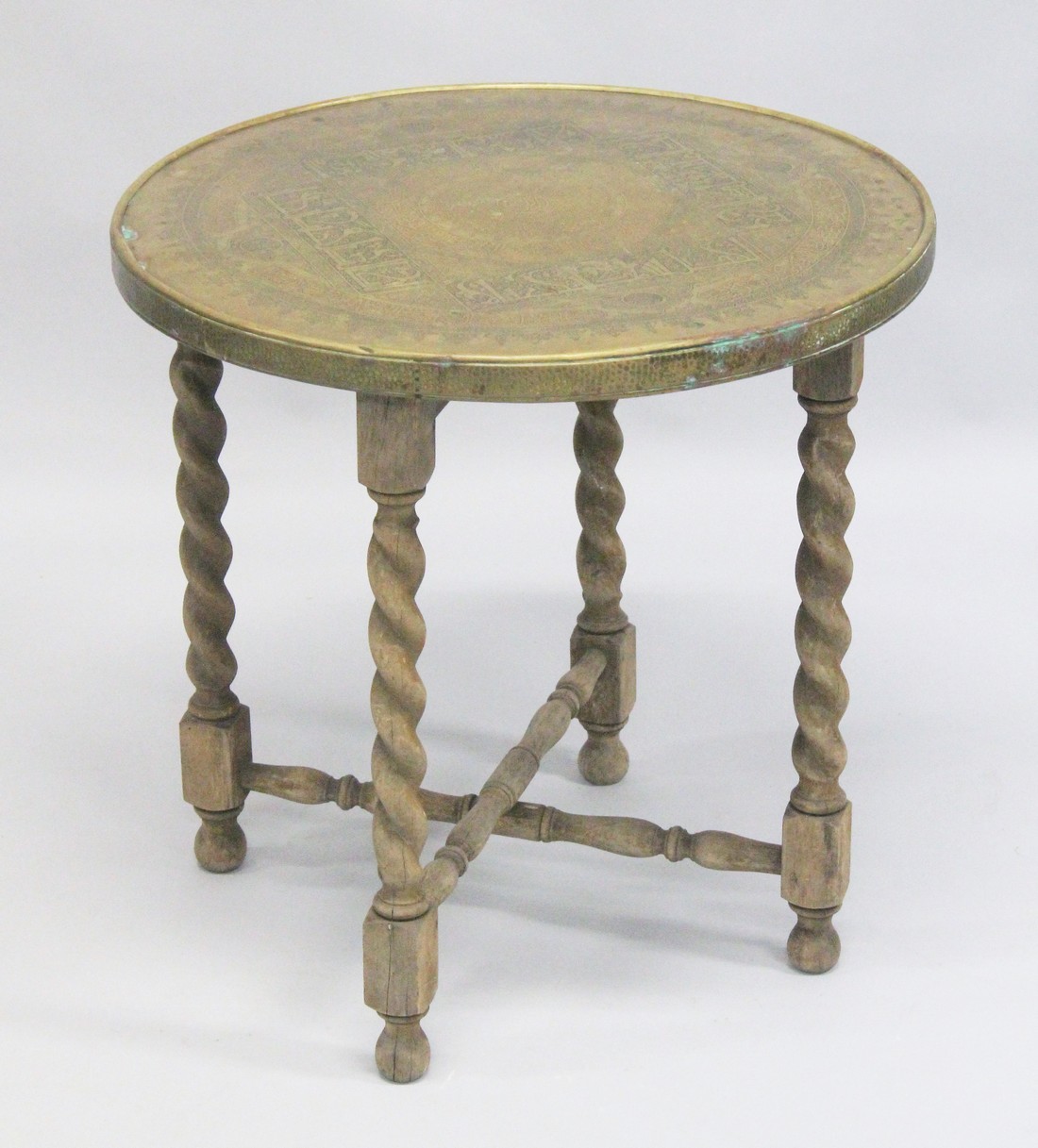 A FINE 19TH CENTURY MAMLUK REVIVAL BRASS TABLE, with folding wooden 'X' form legs, engraved with