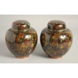A GOOD PAIR OF CHINESE CLOISONNE JARS AND COVERS, finely decorated with various coloured enamel