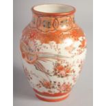 A JAPANESE KUTANI PORCELAIN VASE, painted with birds and flora with fine gilt highlights,