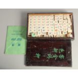 A CHINESE MAHJONG SET, with bone counters in a lidded box.