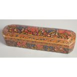 A 19TH CENTURY OTTOMAN PAPIER MACHE PEN BOX, painted with floral decoration and exotic birds, the