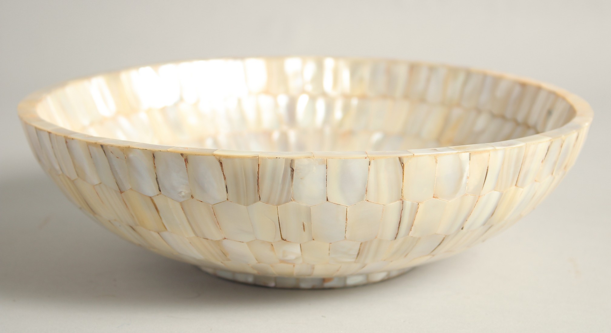 A LARGE MOTHER OF PEARL BOWL, 26cm diameter.