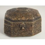 AN INDIAN OPENWORKED BRASS LIDDED CASKET, with openwork floral decoration all over, the hinged lid