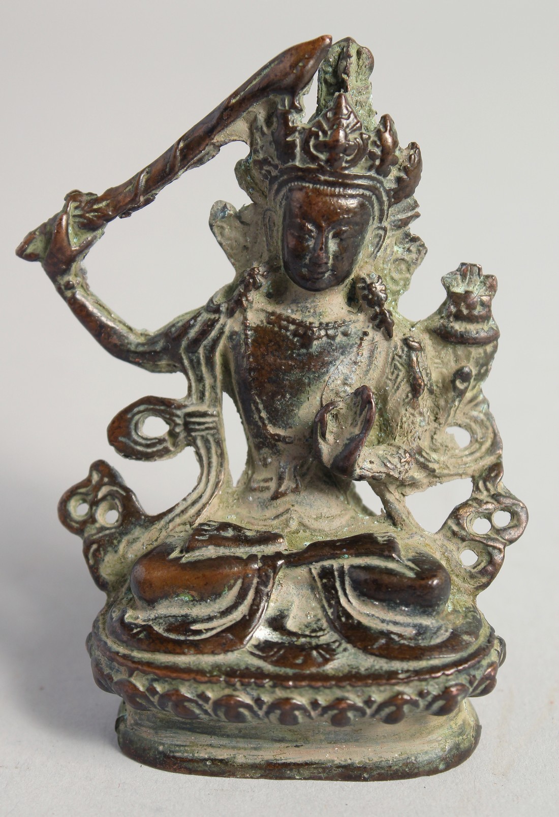 A SMALL TIBETAN BRONZE BUDDHA, 7.5cm high.