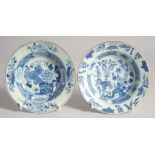 TWO SIMILAR CHINESE BLUE AND WHITE PORCELAIN SHALLOW BOWLS, one painted with flowers against a