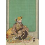 A LARGE INDIAN PAINTING ON PAPER, depicting a seated dignitary holding a tulwar with fine gilt