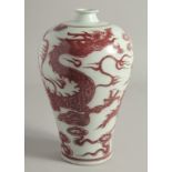A CHINESE IRON RED AND WHITE PORCELAIN MEIPING VASE, the body decorated with a large dragon and