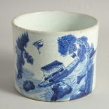 A CHINESE BLUE AND WHITE PORCELAIN BRUSH POT, painted with a fishing scene and rows of characters,