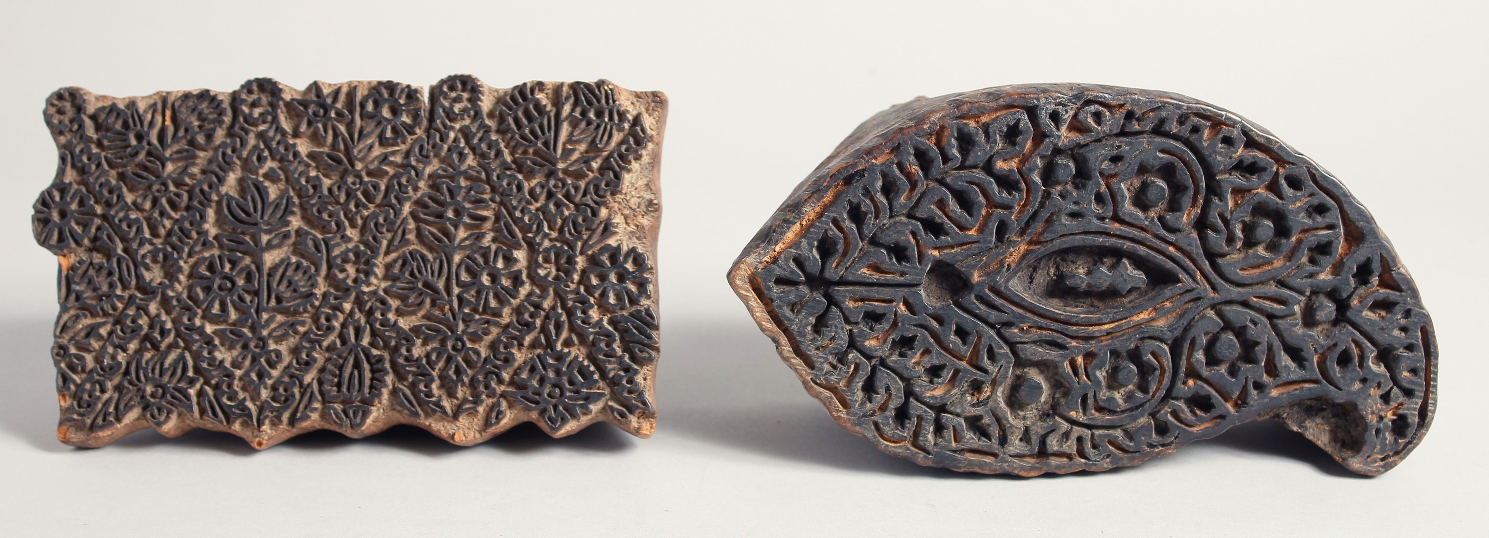 TWO 19TH CENTURY INDO-PERSIAN KALAMKARI WOODEN PRINTING BLOCKS, carved with foliate design, 18cm x