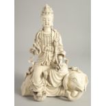 A DEHUA PORCELAIN GUANYIN FIGURE, seated upon an elephant, the reverse with impressed marks. 32cm