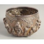 A SMALL INDIAN EMBOSSED SILVER BOWL, with relief decoration of figures / deities, 10cm diameter,