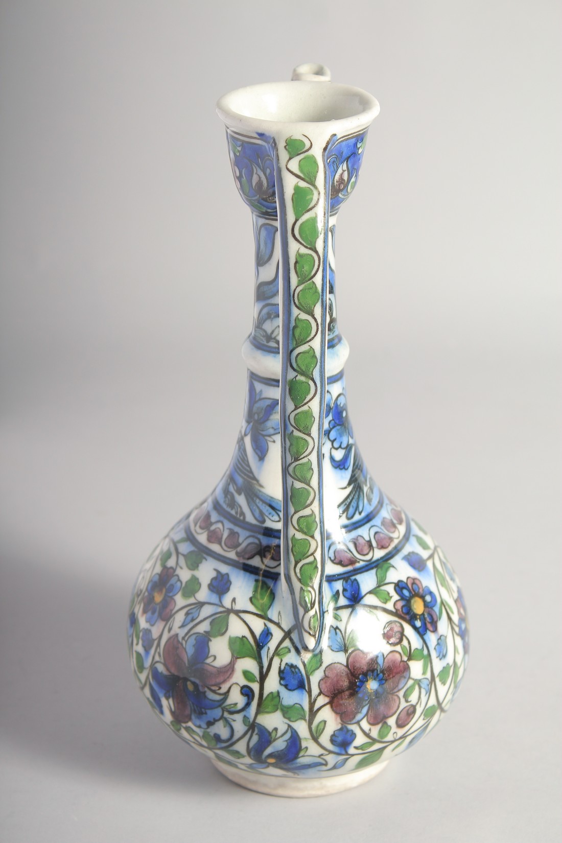 A 19TH CENTURY PERSIAN QAJAR GLAZED POTTERY EWER, painted with birds, flower heads, and scrolling - Image 4 of 6