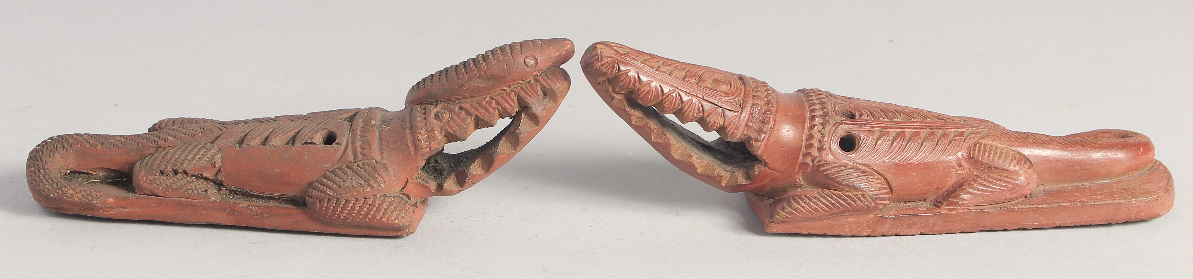 TWO 19TH CENTURY OTTOMAN EGYPTIAN TOPHANE CLAY CROCODILE FOOT SCRUBBERS. 22cm and 19cm