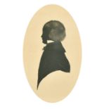 19th Century, a silhouette portrait of a boy, black ink and wash, 6.75" x 4.25" (17 x 11cm), oval.