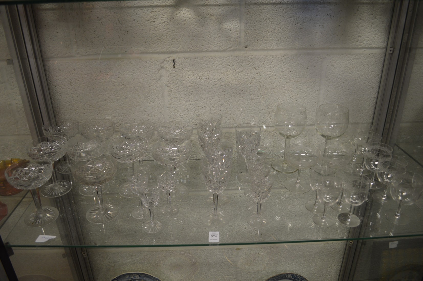Cut and etched glassware to include champagne saucers.