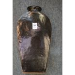 A black glazed slab sided pottery vase.
