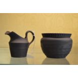 A small black Jasper ware jug and bowl.