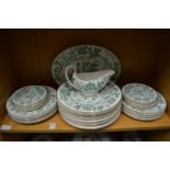 A Wedgwood part dinner service with green floral decoration.