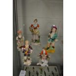 A small group of porcelain figures and figurines.