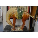 A large Tang style pottery horse.