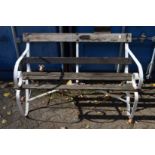 A garden bench with a wrought iron frame.