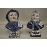 A pair of small pottery busts of a fisherman and a fisher wife.